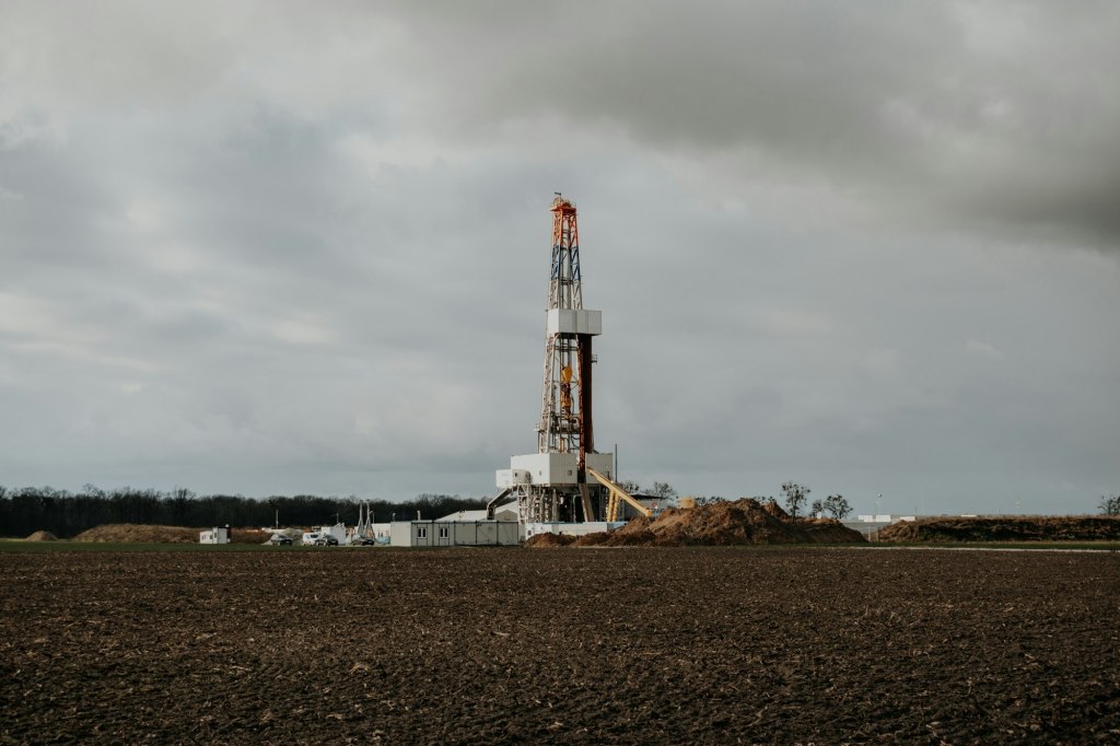 Drilling rig standing in an open field