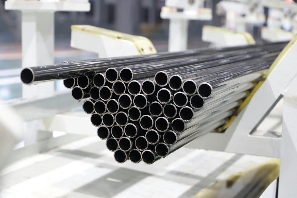 Stack of steel pipes on a manufacturing line